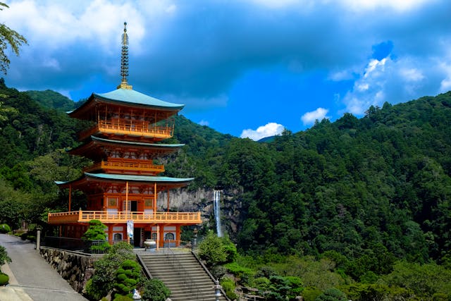 Ancient temple ruins in Asia surrounded by trees at sunrise