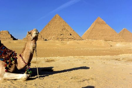 The Pyramids of Giza and the Great Sphinx under a clear blue sky