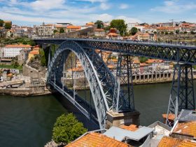 Colorful buildings along the Douro River in Porto, Portugal during sunset