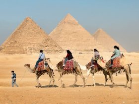Aerial view of the Great Pyramid of Giza with shadow and desert background
