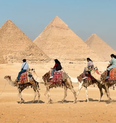 Aerial view of the Great Pyramid of Giza with shadow and desert background