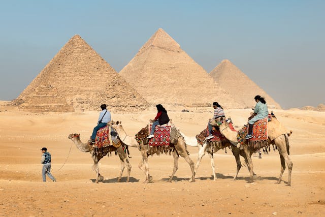 Aerial view of the Great Pyramid of Giza with shadow and desert background