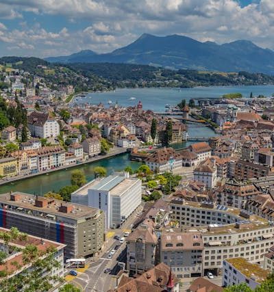View of Lucerne’s Chapel Bridge over the Reuss River with Mount Pilatus in the background