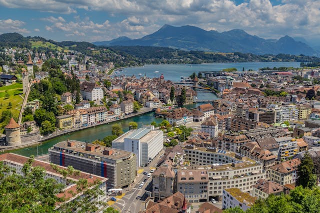 View of Lucerne’s Chapel Bridge over the Reuss River with Mount Pilatus in the background