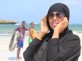 Aerial view of Lido Beach in Mogadishu with people and colorful fishing boats